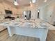 Kitchen island features granite counters, white cabinetry, and pendant lighting at 609 Sienna Way, Summerville, SC 29486