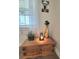 Charming wooden chest with decorative plants and candle enhancing a cozy atmosphere at 609 Sienna Way, Summerville, SC 29486