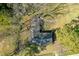 Aerial shot showcasing the roof and surrounding trees, capturing the property's layout at 6156 Badham Dr, Reevesville, SC 29471