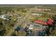 Commercial property aerial view showcasing gas station, hotels, and nearby highway access at 6156 Badham Dr, Reevesville, SC 29471