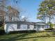 Charming single-story home with a well-maintained lawn and a welcoming front entrance at 6156 Badham Dr, Reevesville, SC 29471