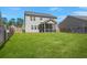 Expansive green backyard with privacy fence and patio, perfect for outdoor activities and relaxation at 686 Redbud Ln, Summerville, SC 29486