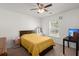 Neutral bedroom with a wooden bed frame, large window, and black side table at 686 Redbud Ln, Summerville, SC 29486