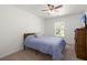 Minimalist bedroom featuring carpeting, ceiling fan, and good natural light at 686 Redbud Ln, Summerville, SC 29486