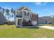 Charming two-story home with brick and siding, offering a well-manicured lawn and inviting curb appeal at 686 Redbud Ln, Summerville, SC 29486