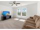 Living room with lots of natural light, ceiling fan, and a TV at 686 Redbud Ln, Summerville, SC 29486