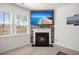 Cozy living room featuring a stone fireplace and a mounted television at 686 Redbud Ln, Summerville, SC 29486