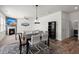 Open-concept living area featuring a fireplace, TV, dining table, and a seamless flow at 686 Redbud Ln, Summerville, SC 29486