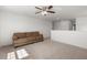 Bright living room with plush carpeting, ceiling fan and a comfortable couch at 686 Redbud Ln, Summerville, SC 29486