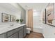 Clean bathroom featuring a large vanity with a white countertop and a combined shower-tub at 739 Meadowbrook Ln, Summerville, SC 29486