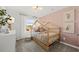 Cozy bedroom with a charming house frame bed and pastel accents at 739 Meadowbrook Ln, Summerville, SC 29486