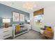 Serene Bedroom with a white crib, cozy rocking chair, and calming decor at 739 Meadowbrook Ln, Summerville, SC 29486