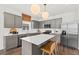 Modern kitchen featuring grey cabinetry, stainless steel appliances, and a bright white quartz countertop island at 739 Meadowbrook Ln, Summerville, SC 29486