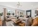 Bright and airy living room featuring plush seating, a large window, and stylish decor at 739 Meadowbrook Ln, Summerville, SC 29486