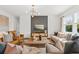 Stylish living room showcasing elegant furnishings, modern lighting, and a sophisticated accent wall at 739 Meadowbrook Ln, Summerville, SC 29486