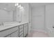 Elegant bathroom with a double vanity, a large mirror, and modern fixtures, offering a spacious and well-lit area at 752 Maynard Ln, Summerville, SC 29486
