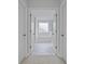 Luxurious bathroom featuring a soaking tub and marble tile flooring at 752 Maynard Ln, Summerville, SC 29486