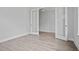Bright bedroom featuring light gray walls, white trim and double glass paneled doors at 752 Maynard Ln, Summerville, SC 29486