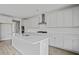 Bright kitchen with white cabinets, a center island, and stainless steel range at 752 Maynard Ln, Summerville, SC 29486