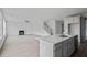 Open kitchen and living space with an island and stainless steel appliances at 752 Maynard Ln, Summerville, SC 29486