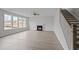 Open living room with a fireplace, large windows, and wood-style floors at 752 Maynard Ln, Summerville, SC 29486