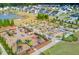 Aerial view of the playground and community, showcasing the lush landscaping, playground amenities, and tranquil lake at 85 Arrowwood Way, Summerville, SC 29485