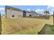 A spacious backyard features a healthy lawn, a wood fence, and several homes, providing a welcoming outdoor space at 85 Arrowwood Way, Summerville, SC 29485