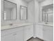 Bright bathroom featuring double sinks, modern mirrors, and white shaker cabinets at 85 Arrowwood Way, Summerville, SC 29485