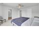 Bright bedroom showcasing carpet flooring, a ceiling fan, and a connected bathroom at 85 Arrowwood Way, Summerville, SC 29485