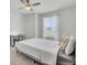 Bright bedroom with a ceiling fan, plush bed and bright window at 85 Arrowwood Way, Summerville, SC 29485