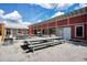 Exterior of community pavilion with long tables and benches for outdoor gathering at 85 Arrowwood Way, Summerville, SC 29485