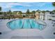 A large community pool with lounge chairs and palm trees at 85 Arrowwood Way, Summerville, SC 29485