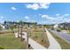 Beautiful aerial view of a community park lined with palm trees and sidewalks at 85 Arrowwood Way, Summerville, SC 29485