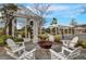 Community fire pit with Adirondack chairs surrounded by landscaping at 85 Arrowwood Way, Summerville, SC 29485