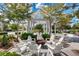 Relaxing community firepit with seating arranged around a central fire pit and gazebo at 85 Arrowwood Way, Summerville, SC 29485