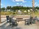 A community area with Adirondack chairs around a fire pit at 85 Arrowwood Way, Summerville, SC 29485