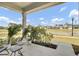 Inviting front porch with potted palm trees and seating, perfect for relaxing at 85 Arrowwood Way, Summerville, SC 29485