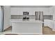 Bright kitchen features stainless appliances, white cabinets, a central island, and tile backsplash at 85 Arrowwood Way, Summerville, SC 29485