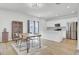 Bright, open kitchen with stainless steel appliances and a large island with a dining table on the side at 85 Arrowwood Way, Summerville, SC 29485