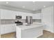 White kitchen design featuring stainless steel appliances, a large center island, and ample cabinet space at 85 Arrowwood Way, Summerville, SC 29485