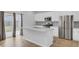 Modern kitchen featuring white cabinets, stainless steel appliances, and a center island at 85 Arrowwood Way, Summerville, SC 29485