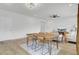 Open-concept living and dining area with hardwood floors and modern furnishings and a television on the wall at 85 Arrowwood Way, Summerville, SC 29485
