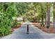 A serene walking path leads through lush greenery, offering a peaceful escape at 85 Arrowwood Way, Summerville, SC 29485