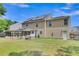 Back of home featuring a large yard, screened-in porch, and hot tub, perfect for outdoor enjoyment at 9360 S Moreto Cir, Summerville, SC 29485
