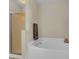 Bathroom featuring a soaking tub, separate shower, and neutral walls providing a spa-like experience at 9360 S Moreto Cir, Summerville, SC 29485