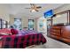 Spacious bedroom features a tray ceiling, ceiling fan and TV at 9360 S Moreto Cir, Summerville, SC 29485
