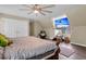 This bedroom features wood floors, closet space, and a mounted TV at 9360 S Moreto Cir, Summerville, SC 29485