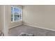 Empty bedroom with neutral walls, carpet, and a window providing natural light, ready for personalization at 9360 S Moreto Cir, Summerville, SC 29485