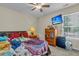 This bedroom features a ceiling fan and a dresser with a TV at 9360 S Moreto Cir, Summerville, SC 29485