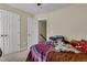 This bedroom features two closets, and is connected to an upstairs hallway via a door at 9360 S Moreto Cir, Summerville, SC 29485